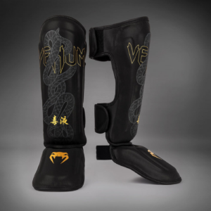 Протектори за крака - Venum Serpenti Shinguards - Black/Silver/Gold​